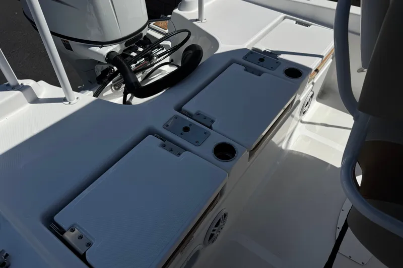 Slide: The Image of 2024 NauticStar 211 Hybrid boat interior with seating and storage compartments. - 22
