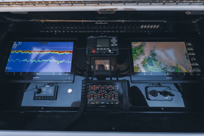 Slide: The Image of Control panel of a 2015 SeaHunter 37 Tournament boat with Garmin displays. - 39