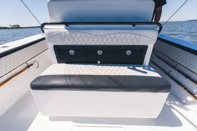 Slide: The Image of 2015 SeaHunter 37 Tournament boat interior with cushioned seating and storage compartments. - 30