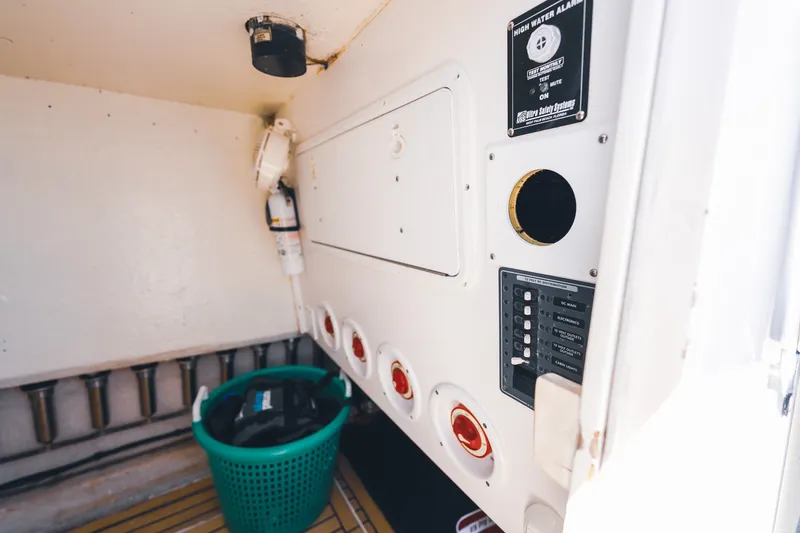 Slide: The Image of Interior of 2015 SeaHunter 37 Tournament boat with control panel and storage basket. - 35
