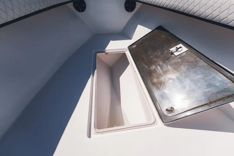 Slide: The Image of Open storage compartment on 2015 SeaHunter 37 Tournament boat deck. - 32