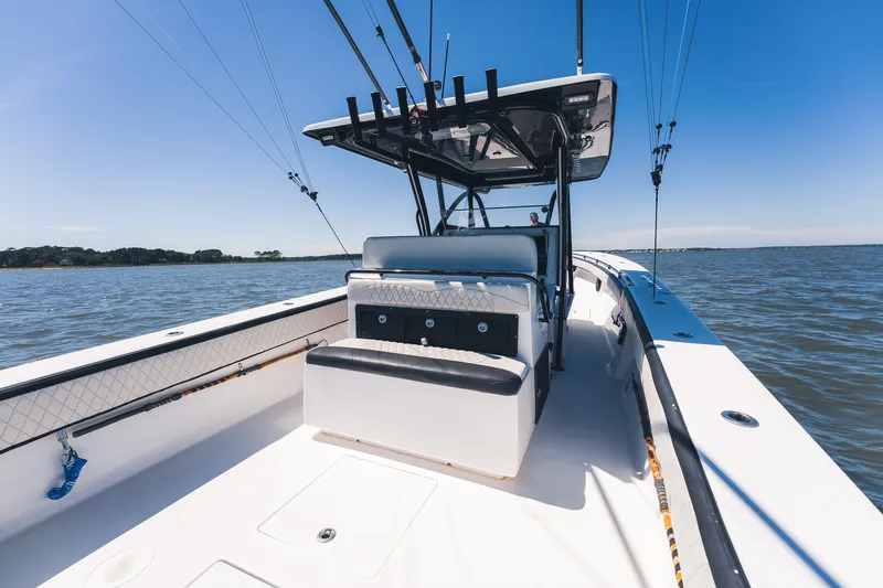 Slide: The Image of 2015 SeaHunter 37 Tournament boat on open water, featuring fishing rods and seating. - 31