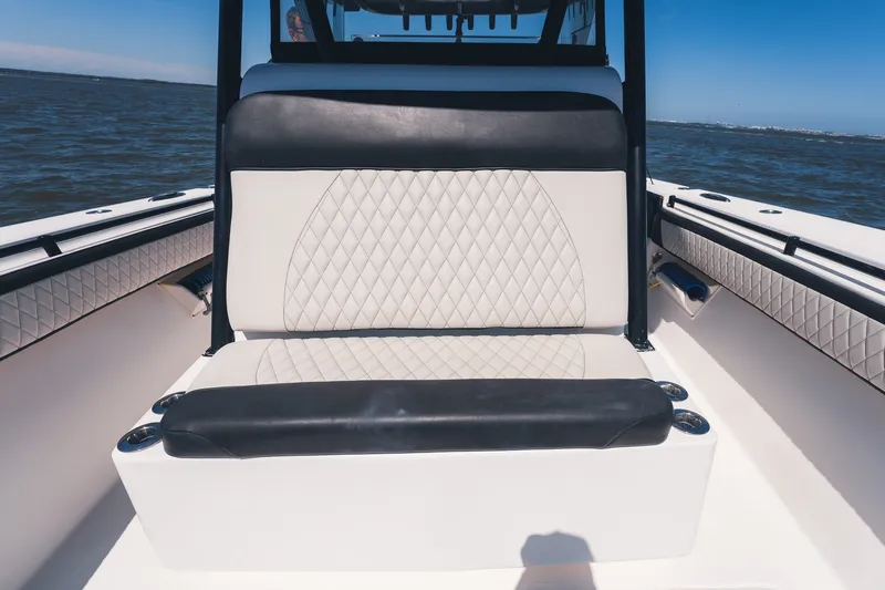 Slide: The Image of 2015 SeaHunter 37 Tournament boat interior with diamond-stitched seating, on open water. - 24