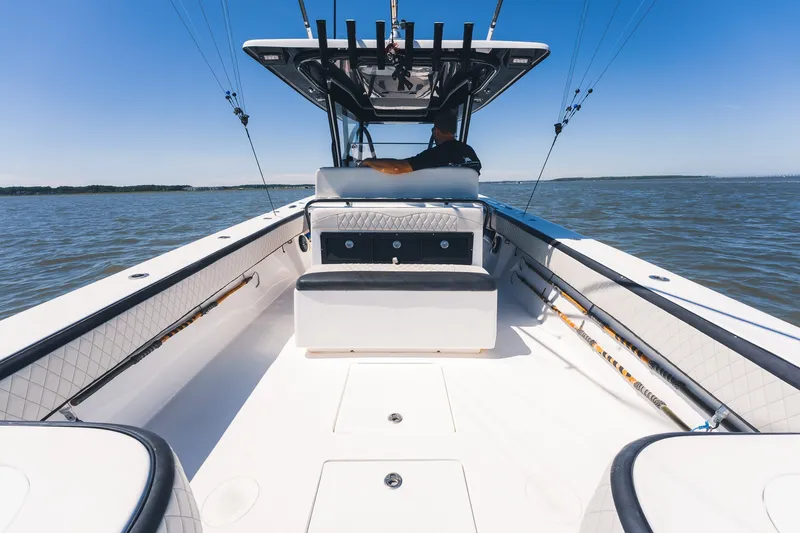 Slide: The Image of 2015 SeaHunter 37 Tournament boat on open water, clear sky, fishing rods visible. - 19