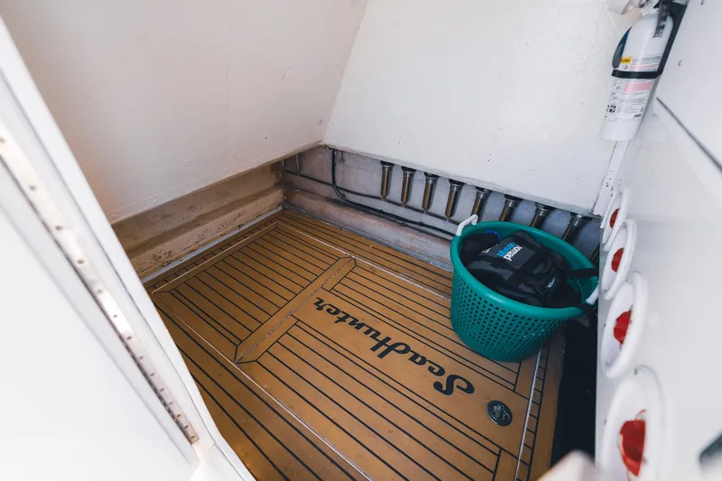 Slide: The Image of Interior of 2015 SeaHunter 37 Tournament boat with storage area and safety equipment. - 34