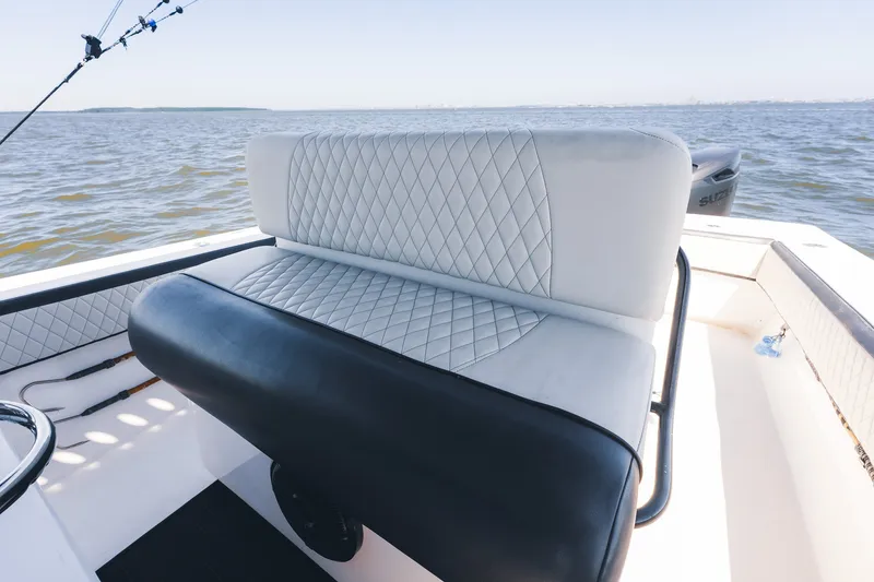 Slide: The Image of 2015 SeaHunter 37 Tournament boat with diamond-stitched seating on open water. - 22