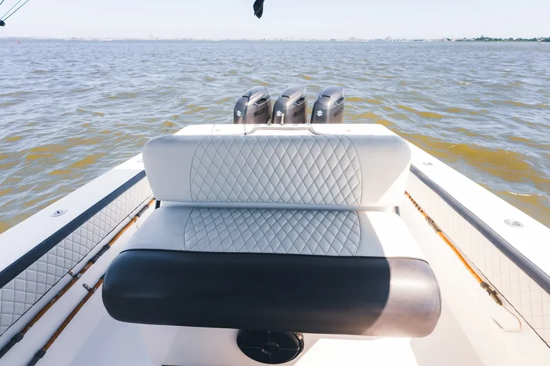 Slide: The Image of 2015 SeaHunter 37 Tournament boat with triple Suzuki engines on open water. - 17