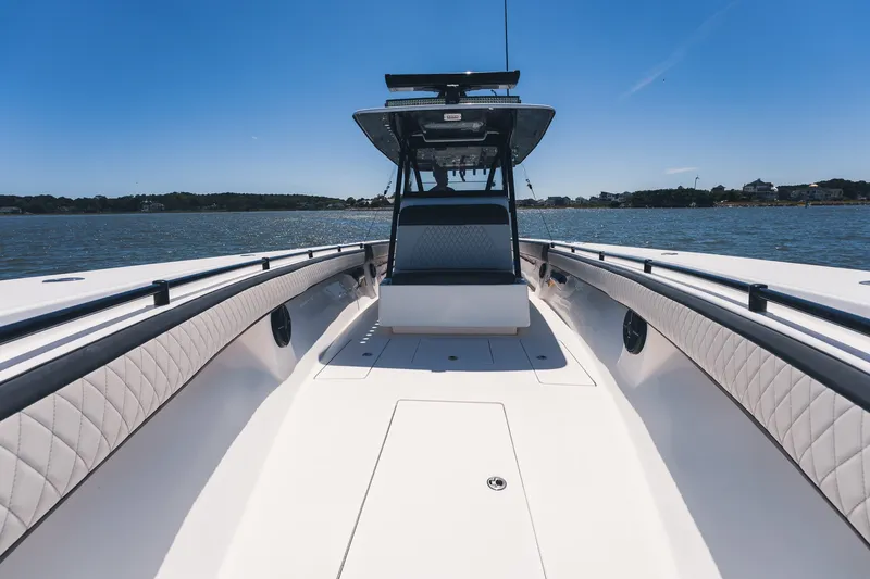 Slide: The Image of 2015 SeaHunter 37 Tournament boat on calm water under clear blue sky. - 14