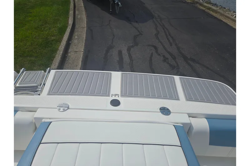 Slide: The Image of 2013 Bayliner 195 Bowrider boat stern view with swim platform and ladder. - 23