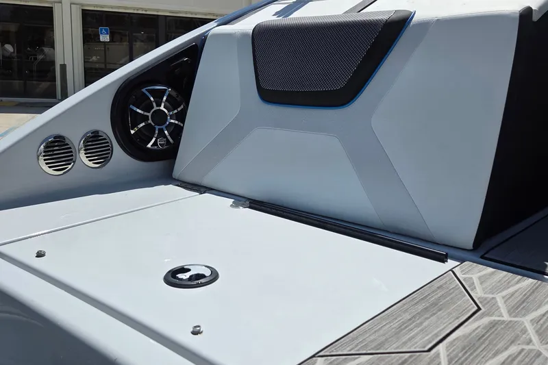 Slide: The Image of 2023 Yamaha Boats 222XD interior detail with speaker and sleek design elements. - 25