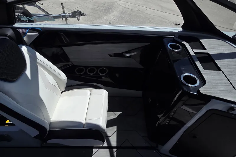 Slide: The Image of Interior of 2023 Yamaha Boats 222XD, featuring sleek seating and modern design elements. - 22