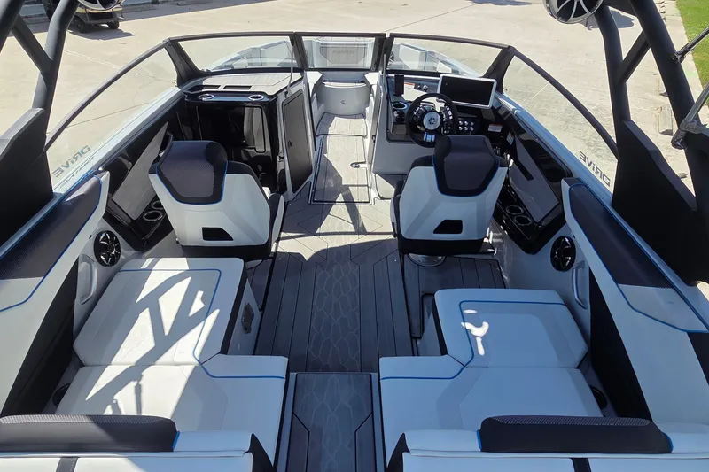 Slide: The Image of 2023 Yamaha Boats 222XD interior with modern seating and sleek dashboard design. - 7