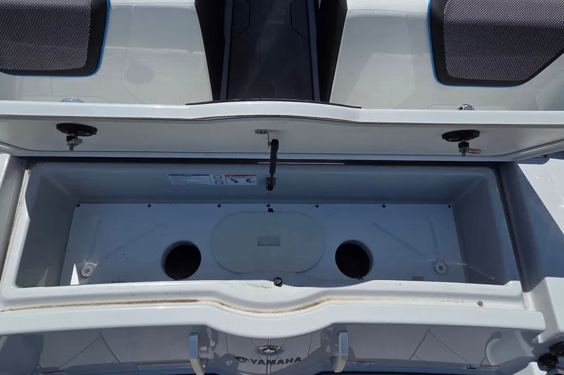 Slide: The Image of Open storage compartment on 2023 Yamaha Boats 222XD, showcasing interior space and design. - 24