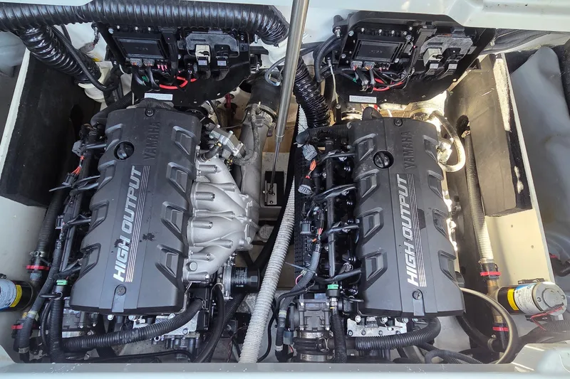Slide: The Image of Twin high-output engines in a 2023 Yamaha Boats 222XD model. - 10