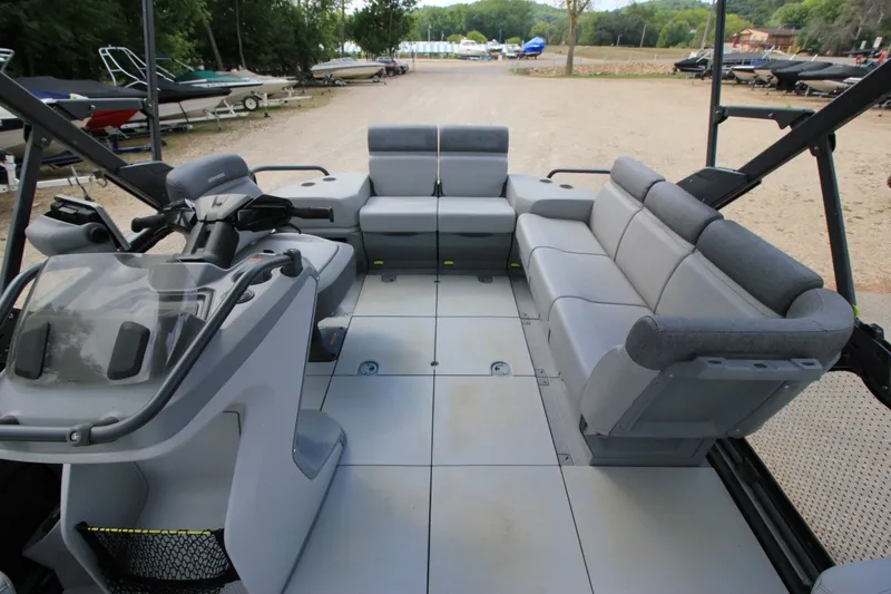 Slide: The Image of 2022 Sea-Doo Switch Sport 18 interior with spacious seating and modern helm design. - 7