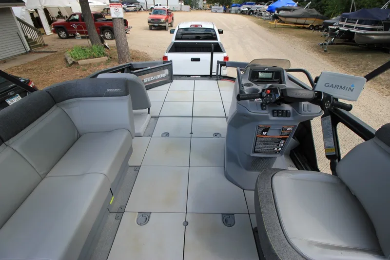 Slide: The Image of 2022 Sea-Doo Switch Sport 18 interior with seating and control console. - 18