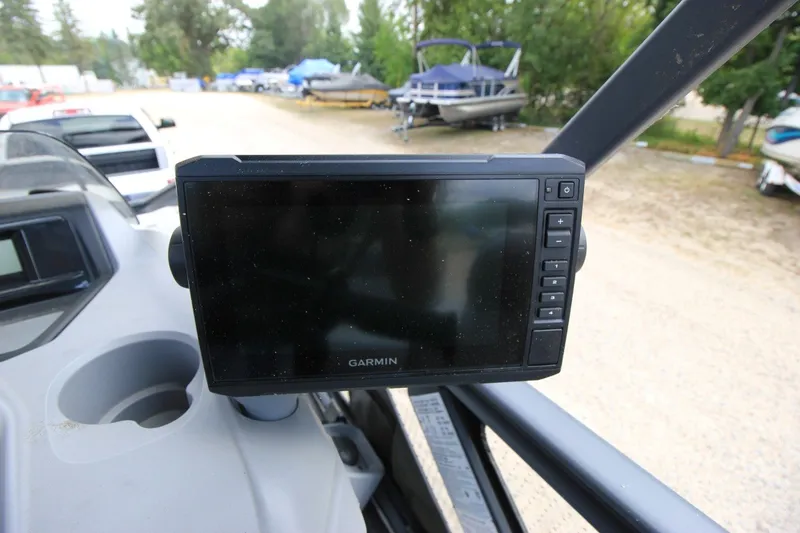 Slide: The Image of Garmin display on 2022 Sea-Doo Switch Sport 18, parked with boats in background. - 17