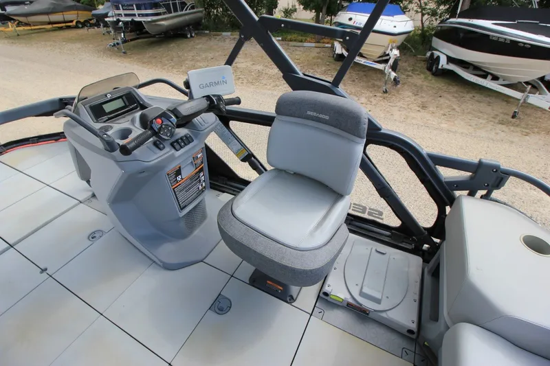 Slide: The Image of 2022 Sea-Doo Switch Sport 18 cockpit with Garmin navigation system and comfortable seating. - 14
