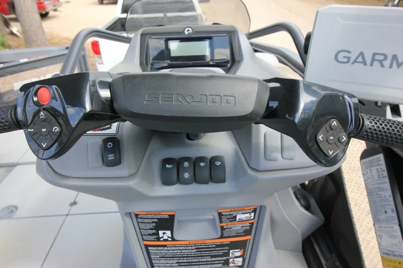 Slide: The Image of Control panel of 2022 Sea-Doo Switch Sport 18 with steering and navigation controls. - 16