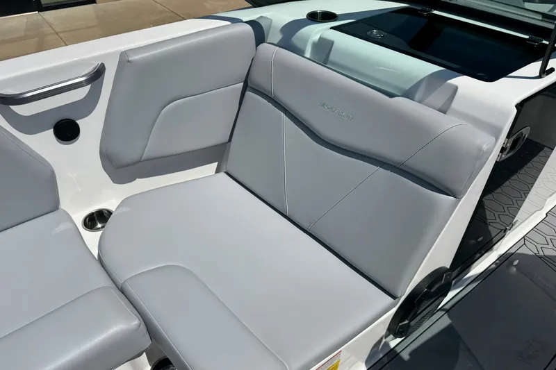 Slide: The Image of 2022 MasterCraft NXT22 boat interior with sleek gray seating and modern design. - 10