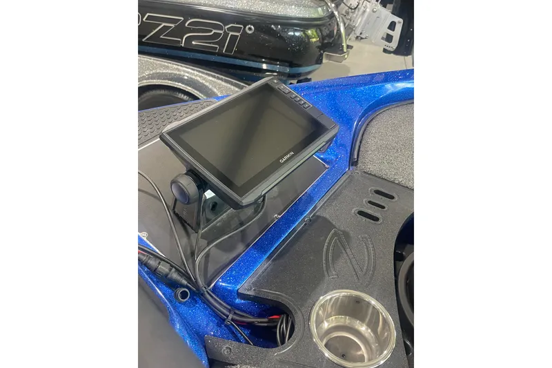 Slide: The Image of 2021 Ranger Z518 boat dashboard with Garmin display and cup holder. - 5