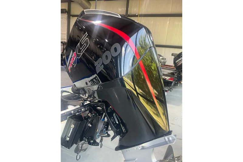 Slide: The Image of 2021 Ranger Z518 boat with Mercury Pro XS 200 outboard motor in a garage. - 9