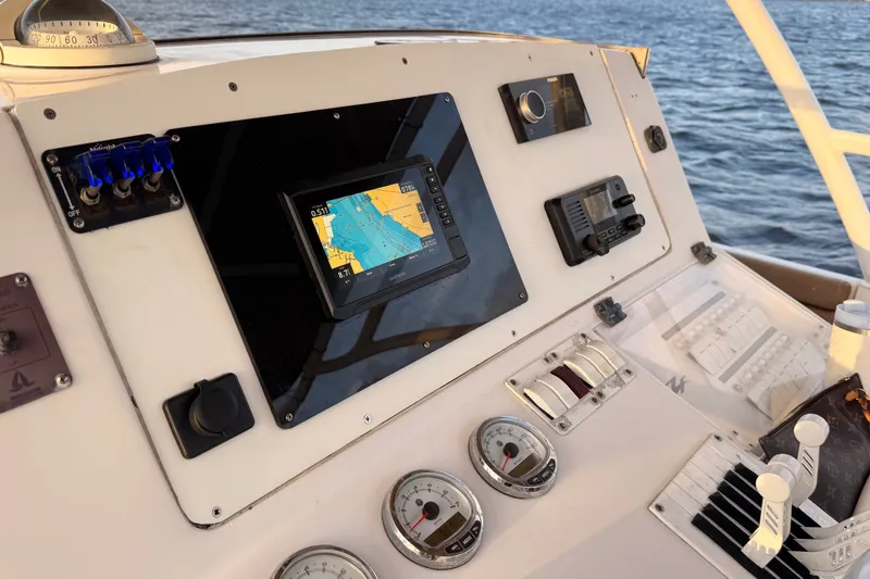 Slide: The Image of Control panel of a 2006 Donzi 38 ZFX Cuddy boat with navigation equipment. - 42