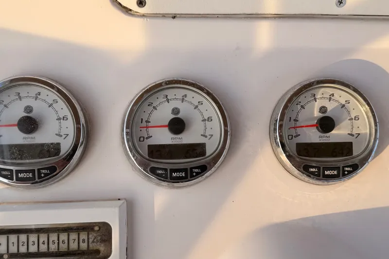 Slide: The Image of Close-up of RPM gauges on a 2006 Donzi 38 ZFX Cuddy boat dashboard. - 40
