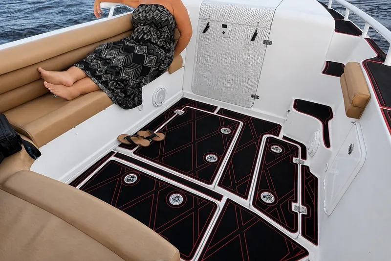 Slide: The Image of 2006 Donzi 38 ZFX Cuddy boat interior with cushioned seating and stylish flooring. - 31