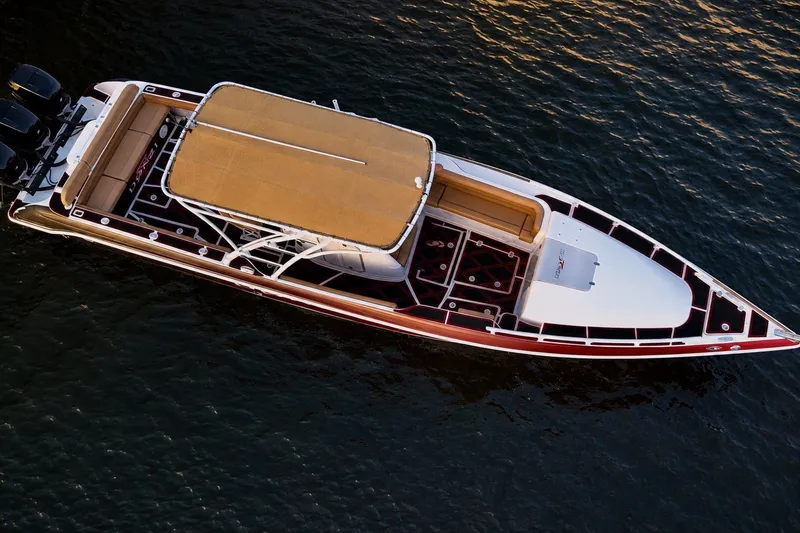 Slide: The Image of Aerial view of 2006 Donzi 38 ZFX Cuddy boat on water. - 13