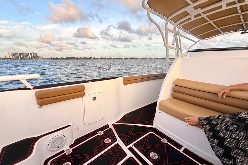 Slide: The Image of 2006 Donzi 38 ZFX Cuddy boat interior with cushioned seating and ocean view. - 32