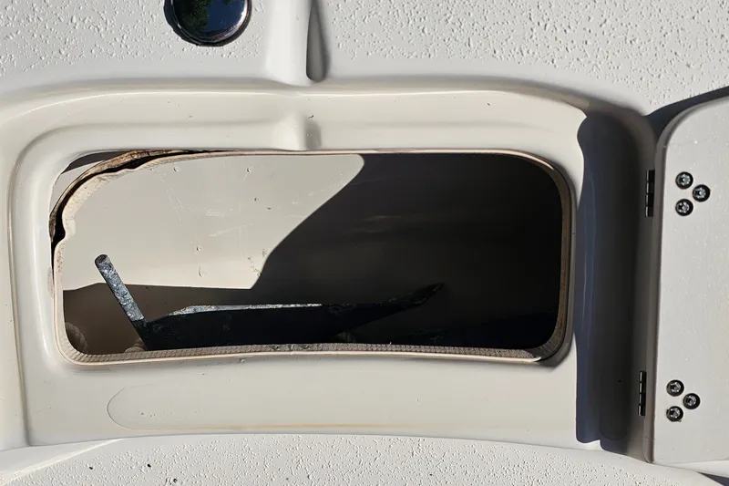 Slide: The Image of Open storage compartment on a 2016 Carolina Skiff 258 DLV boat. - 7