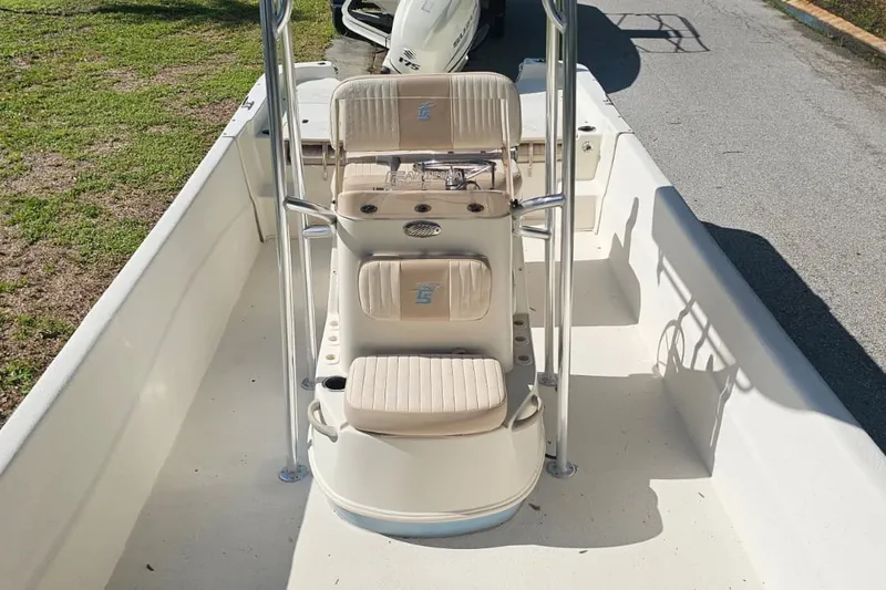 Slide: The Image of 2016 Carolina Skiff 258 DLV boat interior with seating and console. - 8