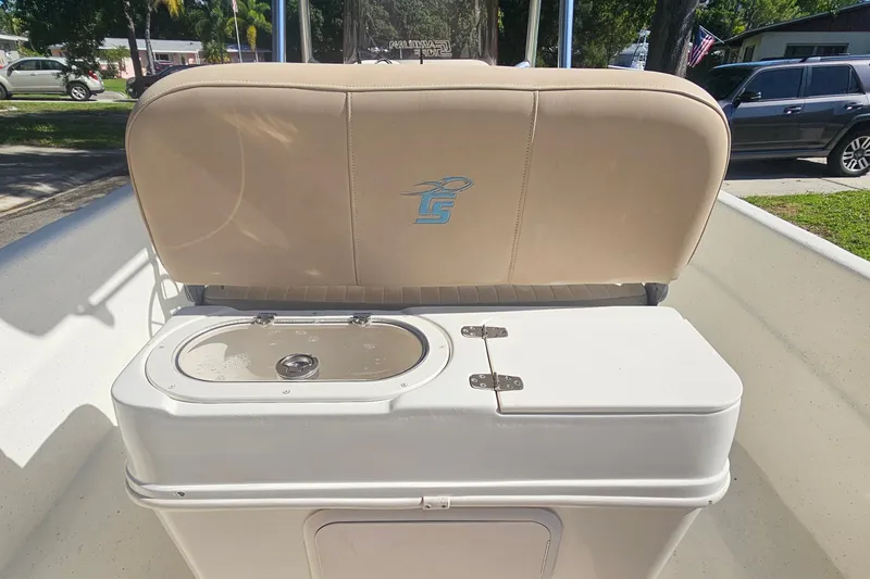 Slide: The Image of 2016 Carolina Skiff 258 DLV boat seat with integrated storage compartment. - 12
