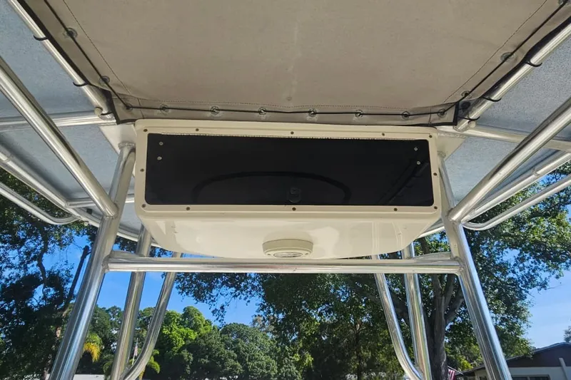 Slide: The Image of 2016 Carolina Skiff 258 DLV T-top with storage compartment, viewed from below. - 11