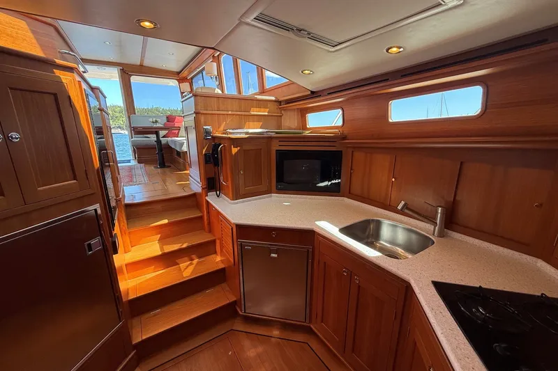 Slide: The Image of Luxurious interior of 2013 York's Marine 46 Flybridge Cruiser with wood finish and modern amenities. - 48