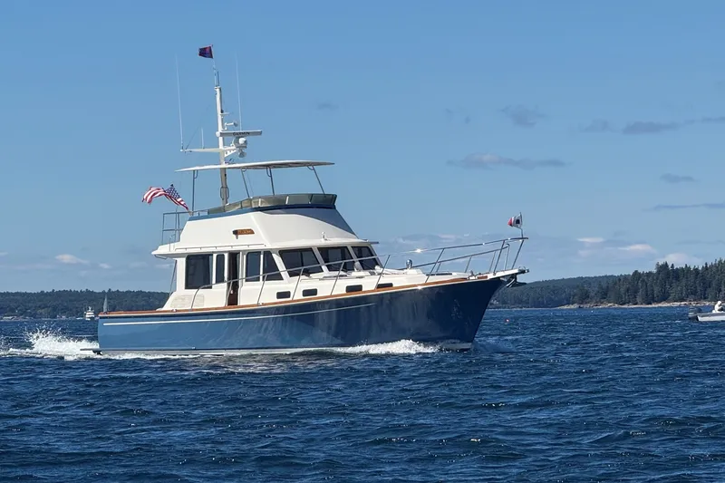 Slide: The Image of 2013 York's Marine 46 Flybridge Cruiser sailing on a sunny day. - 1