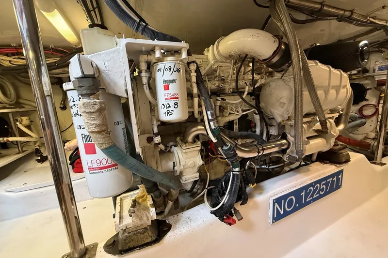 Slide: The Image of Engine room of 2013 York's Marine 46 Flybridge Cruiser, showcasing detailed mechanical components. - 68