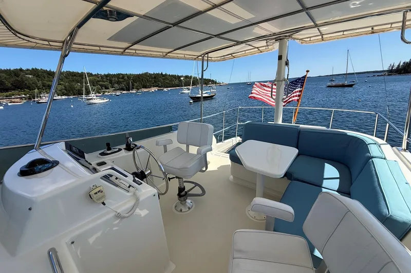 Slide: The Image of Flybridge of 2013 York's Marine 46 Cruiser with seating, helm, and ocean view. - 17