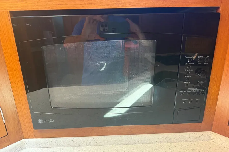 Slide: The Image of Built-in GE Profile microwave in 2013 York's Marine 46 Flybridge Cruiser kitchen. - 46