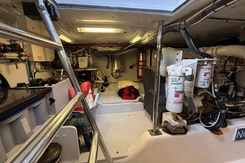 Slide: The Image of Engine room of 2013 York's Marine 46 Flybridge Cruiser, showcasing mechanical components and equipment. - 62