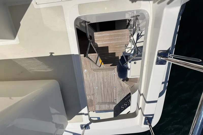 Slide: The Image of York's Marine 46 Flybridge Cruiser 2013, view of deck stairs and railing. - 16