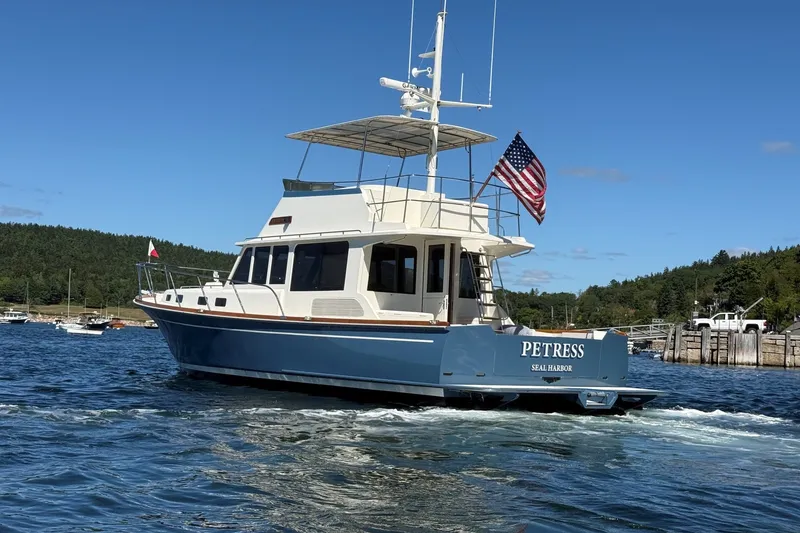 Slide: The Image of York's Marine 46 Flybridge Cruiser, 2013 model, sailing in scenic waters. - 4