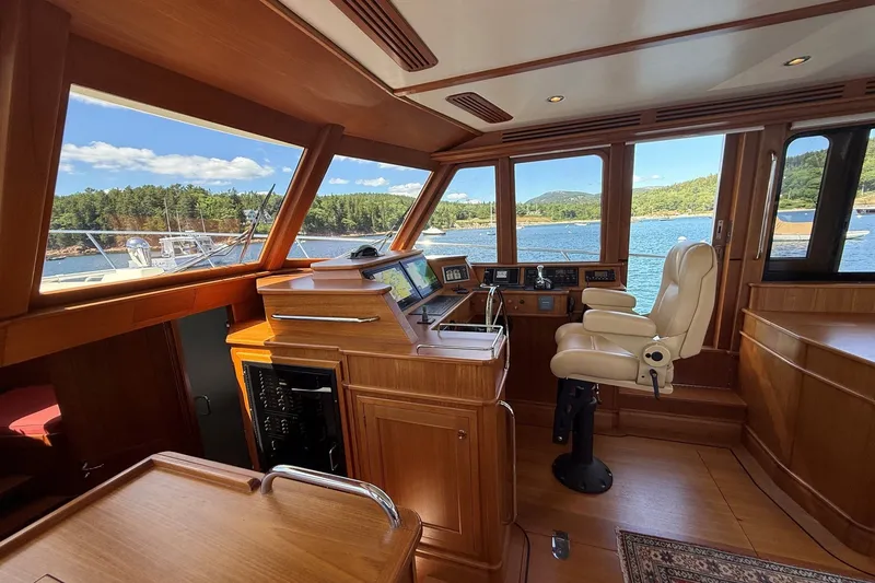 Slide: The Image of Luxurious interior of 2013 York's Marine 46 Flybridge Cruiser with scenic water view. - 36