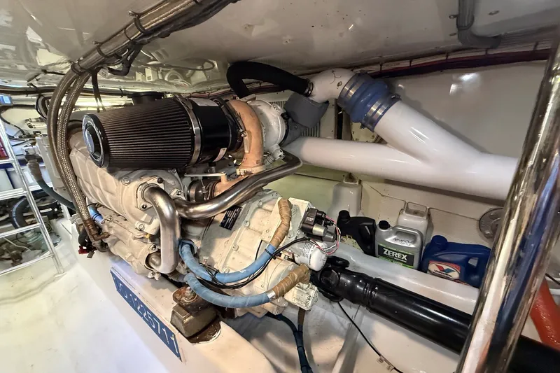 Slide: The Image of Engine room of 2013 York's Marine 46 Flybridge Cruiser, showcasing detailed mechanical components. - 69