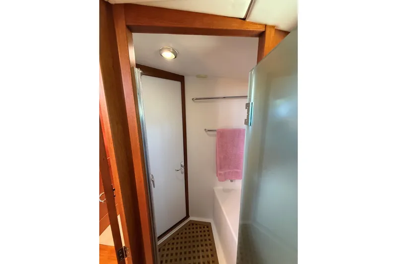 Slide: The Image of Bathroom interior of 2013 York's Marine 46 Flybridge Cruiser with towel and shower. - 52