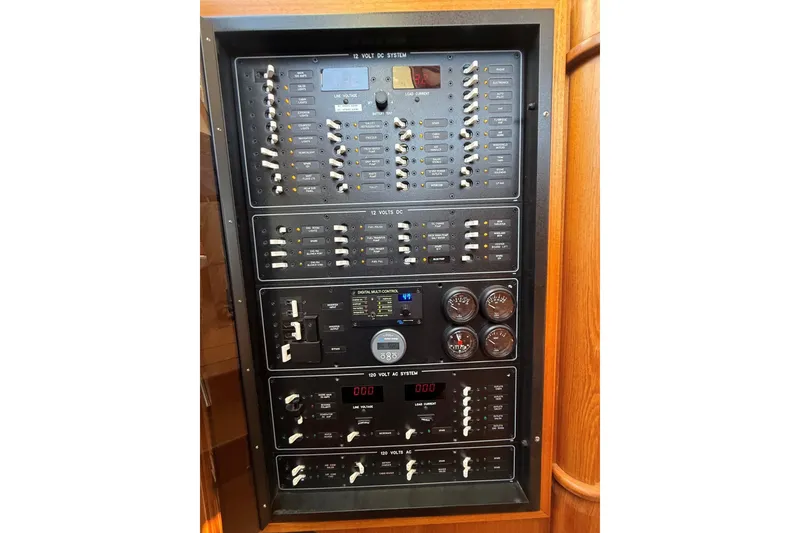 Slide: The Image of Electrical control panel on a 2013 York's Marine 46 Flybridge Cruiser. - 57