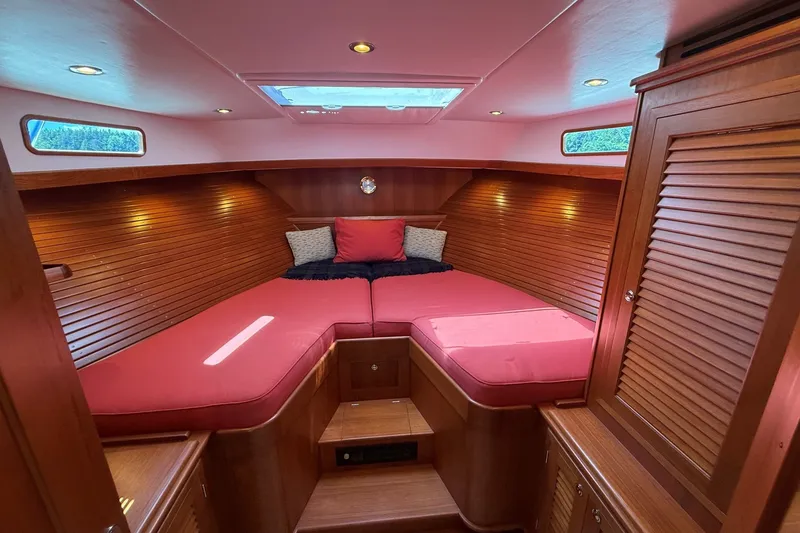 Slide: The Image of Luxurious cabin interior of 2013 York's Marine 46 Flybridge Cruiser with red cushions. - 56