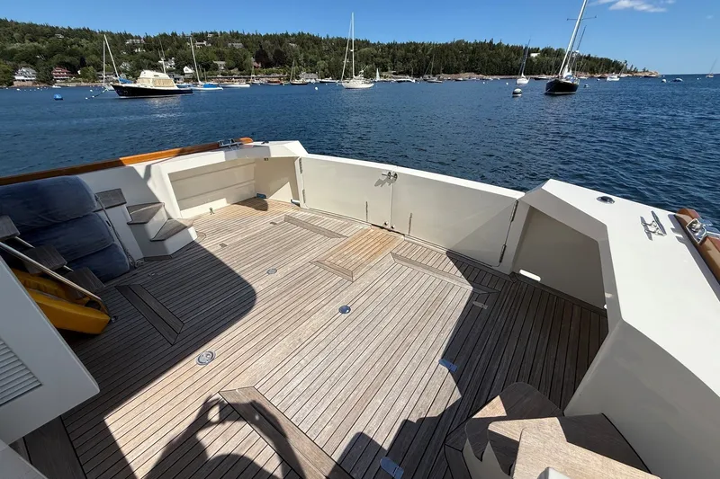 Slide: The Image of Spacious deck of 2013 York's Marine 46 Flybridge Cruiser with scenic harbor view. - 13