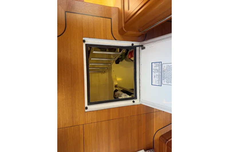 Slide: The Image of Hatch opening on York's Marine 46 Flybridge Cruiser, 2013 model, with visible ladder. - 60